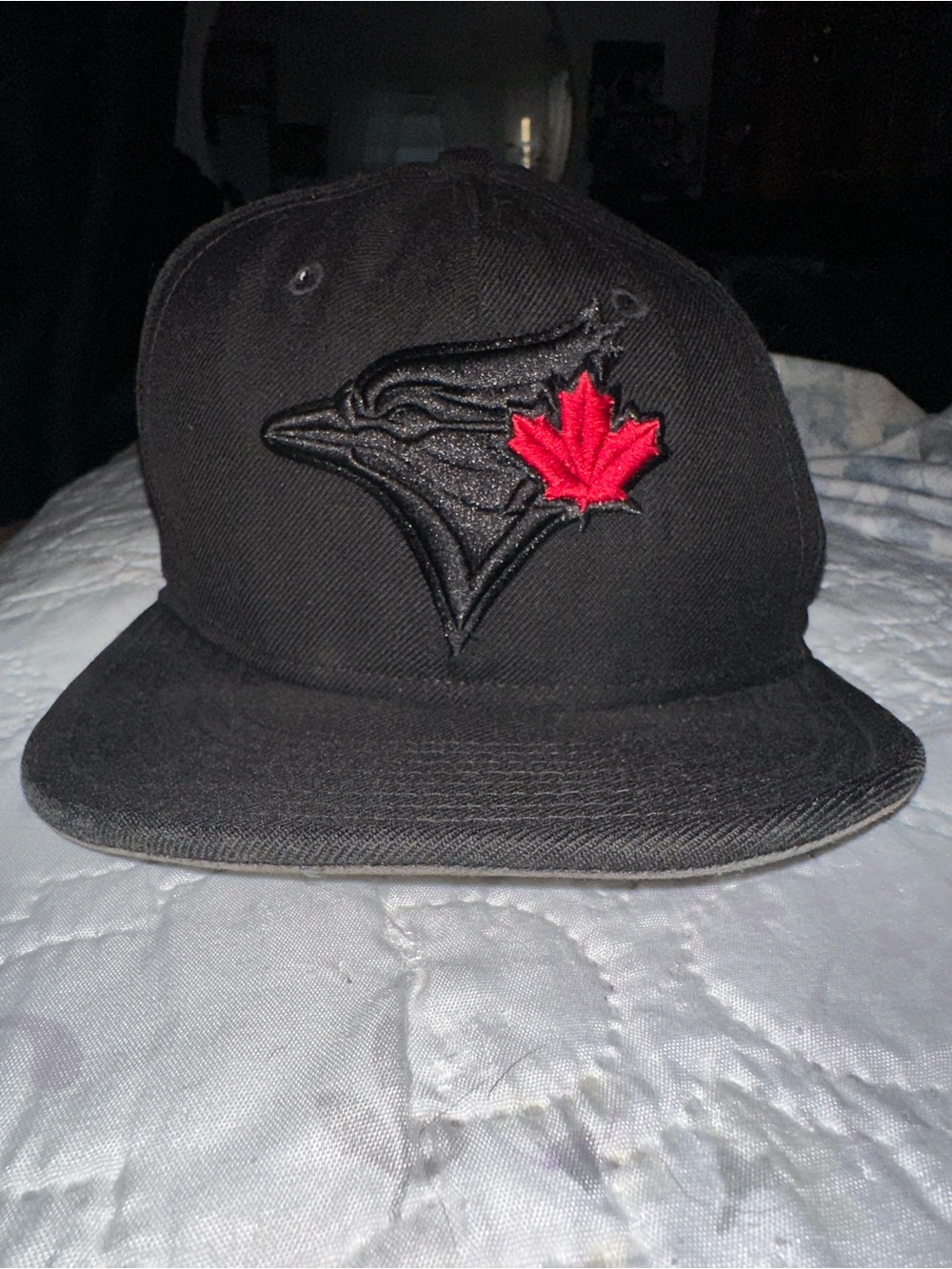 New Era Black Baseball Cap with Red Maple Leaf Accent
